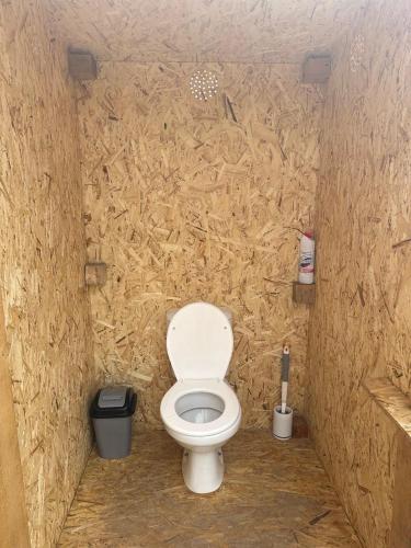 a bathroom with a white toilet in a stall at Son-Köl Glamping in Song-Kul