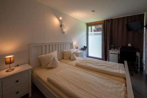 Postel nebo postele na pokoji v ubytování Hotel Vicinity