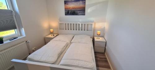 Katil atau katil-katil dalam bilik di Ferienhaus Watt`n Blick - nah an der Nordsee