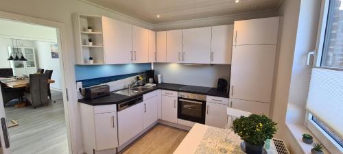 Dapur atau dapur kecil di Ferienhaus Watt`n Blick - nah an der Nordsee