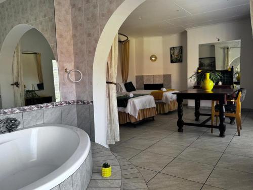 Ένα ή περισσότερα κρεβάτια σε δωμάτιο στο Elsjes Guesthouse