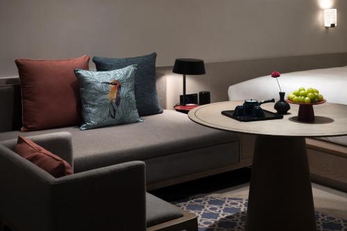 a living room with a couch and a table at Qianzitong First Seeing Hotel in Changping