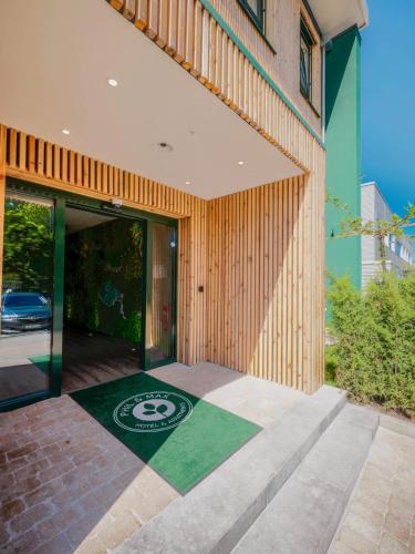 an entrance to a building with a sign on the ground at Hannover - PHIL & MAX Hotels und Apartments Messe in Hannover