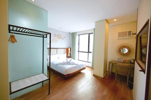 Ένα ή περισσότερα κρεβάτια σε δωμάτιο στο Marianne Suites El Nido