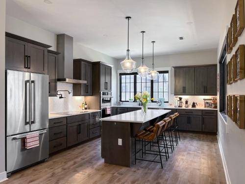 a large kitchen with a large island in the middle at Rock n Stars Chalet townhouse in Hideaway Park