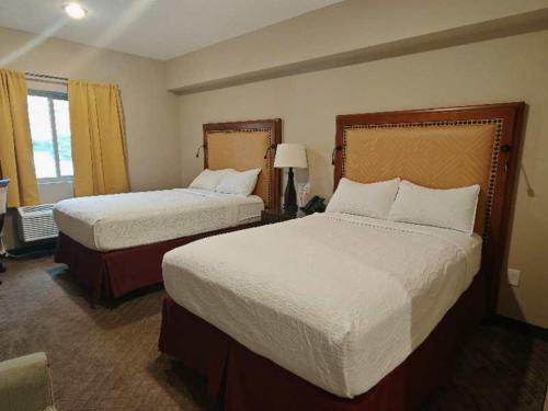 Postel nebo postele na pokoji v ubytování Wagon Wheel Hotel