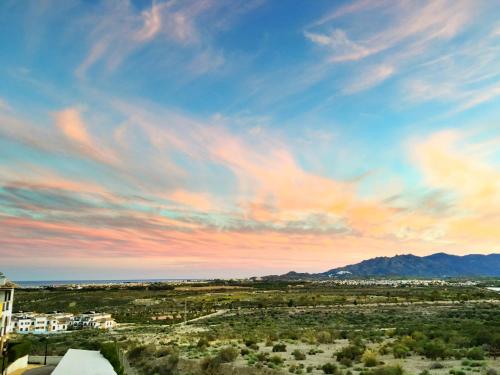 a view of the desert under a cloudy sky at RELAX en Vera Playa con SPA in Vera
