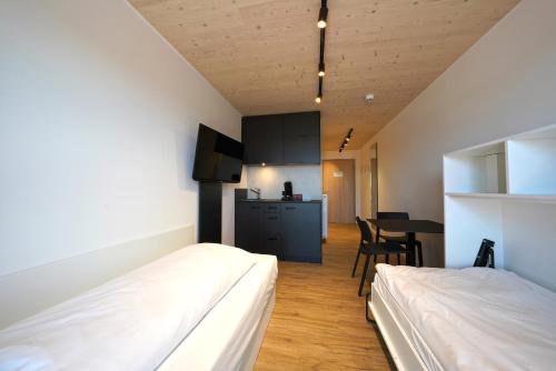 Ένα ή περισσότερα κρεβάτια σε δωμάτιο στο Timber One Boardinghouse Dorfen