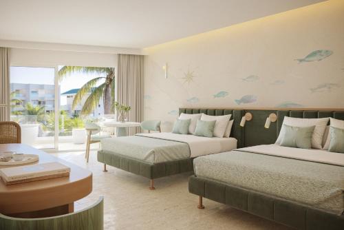 Posezení v ubytování JOIA Aruba by Iberostar