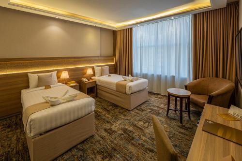 Katil atau katil-katil dalam bilik di Snood Al Azama Hotel