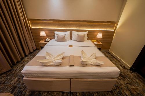 Katil atau katil-katil dalam bilik di Snood Al Azama Hotel