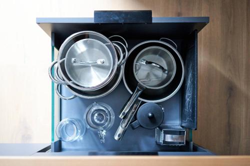 a black box filled with pots and pans at Alte Seifensiederei - Cisco in Bad Tölz