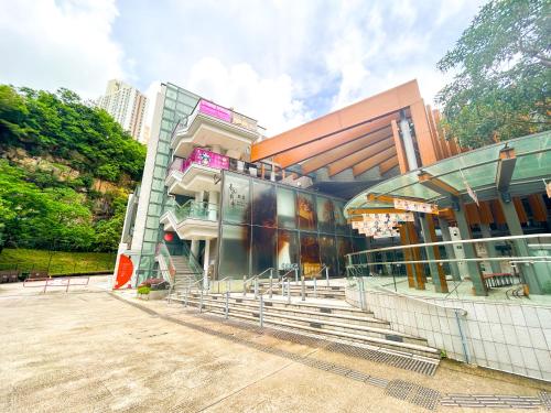 a building with stairs in front of a building at Urbanwood Hung Hom in Hong Kong