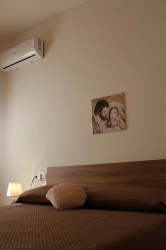 Ένα ή περισσότερα κρεβάτια σε δωμάτιο στο Casa Margherita