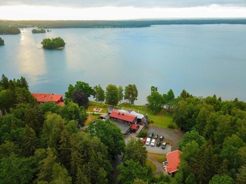 an aerial view of a resort on the shore of a lake at Hotel Ullinge in Eksjö