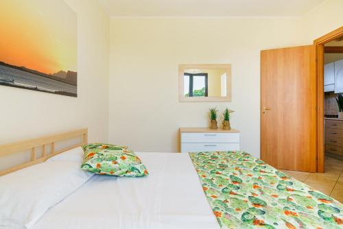 Oasi Kite - Stagnone Apartmentsにあるベッド