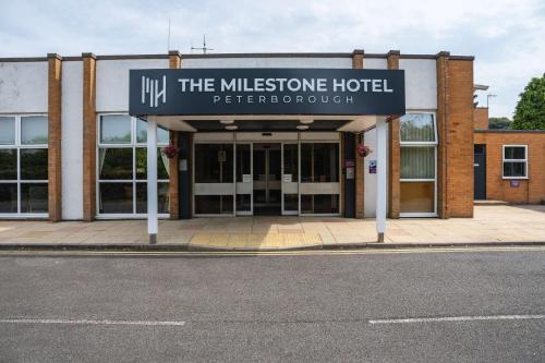 a building with a sign that reads the museum hotel at Milestone Peterborough Hotel A1M, Sure Hotel Collection by Best Western in Peterborough
