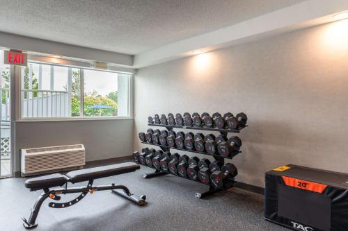 a room with a gym with a bench and weights at Hampton Inn Manchester Downtown in Manchester