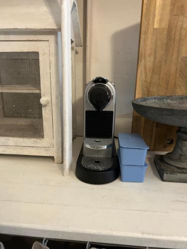 a blender sitting on the floor next to a table at Akasa on Lake Como in Menaggio