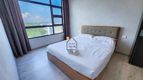 Postel nebo postele na pokoji v ubytování JQ KK Homestay#7 by ShamNook