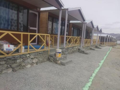 a house being constructed on the side of a mountain at Full Moon Cottages Pangong Ladakh by LexStays in Kakstet