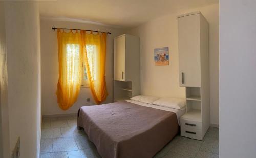 A bed or beds in a room at Borgo del Tennis - Sa Ventana 2