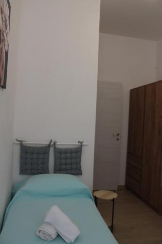 Ένα ή περισσότερα κρεβάτια σε δωμάτιο στο Casa Margherita