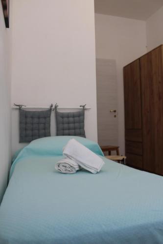 Ένα ή περισσότερα κρεβάτια σε δωμάτιο στο Casa Margherita