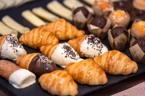 a tray filled with different types of pastries at Hotel Blu Aran in Vielha