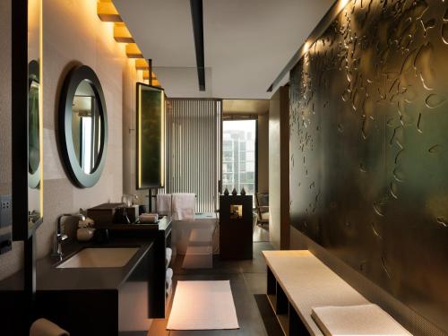 a bathroom with a sink and a mirror at Banyan Tree Dubai at Bluewaters in Dubai