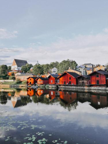 a group of houses next to a body of water at RUNO Hotel Porvoo in Porvoo