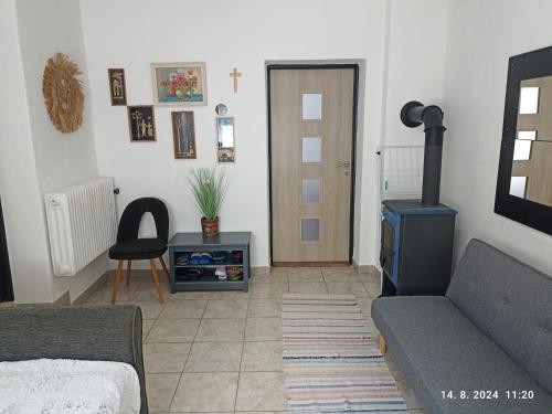 a living room with a couch and a wood stove at Ubytovanie v súkromí - StEJJT in Ober-Turček