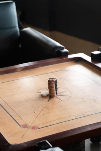 a wooden table with a game of chess on it at Polo Cherrapunjee Resort in Cherrapunji