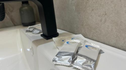 two bags of toothpaste sitting on a counter at Thethi Villas in Theth