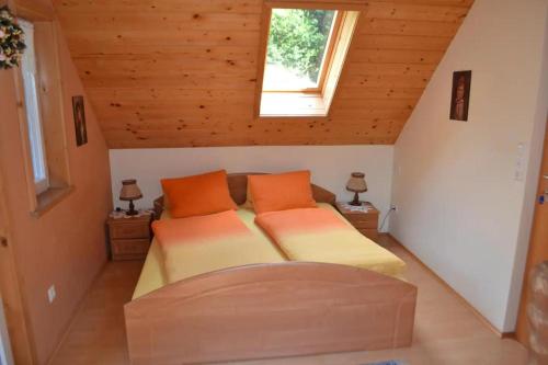 a bedroom with two beds in a attic at Ferienhaus Waldenstein 1 in Waldenstein