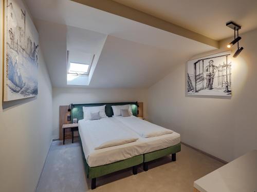 a bedroom with a large bed in a room at Craft Inn - Boutique Hotel in Sibiu