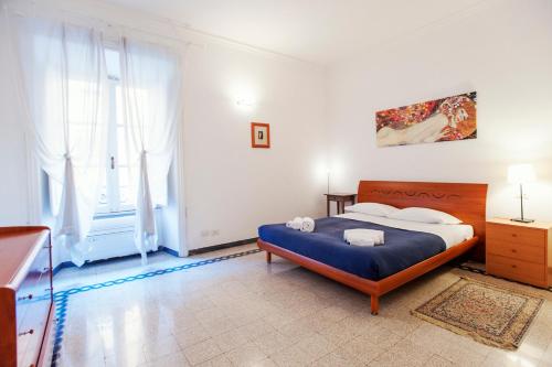 a bedroom with a bed and a large window at Palestrina in Rome