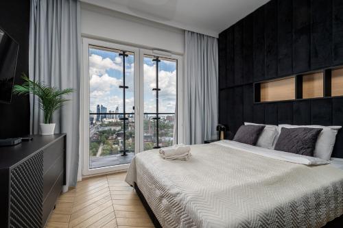 Postel nebo postele na pokoji v ubytování Kasprzaka 29 Panorama Tower 21 Th Floor By Perfect Apart
