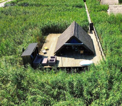 an overhead view of a house in a field at Mountains and Lakes - Romantika 5 Beach Bungalow in Rust