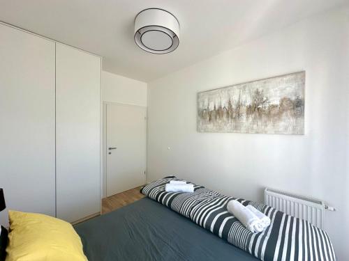 a bedroom with a bed and a painting on the wall at GG home in Krapinske Toplice