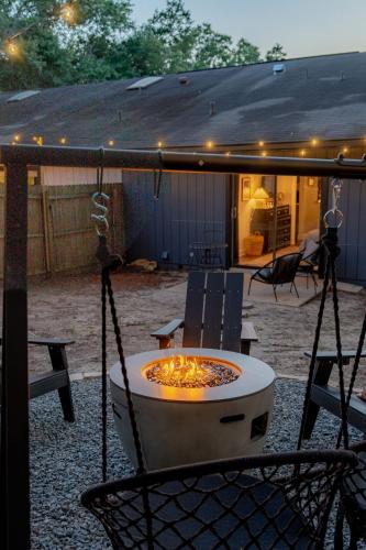 a fire pit in the middle of a patio at High design & coziest comforts in Gainesville