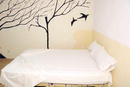 Ένα ή περισσότερα κρεβάτια σε δωμάτιο στο Mandinga Guest house
