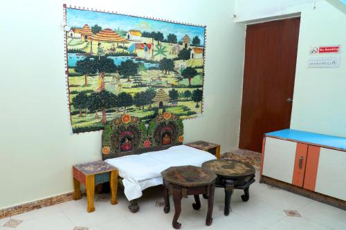 a room with a painting hanging on the wall at Banaji Heritage Havelii in Jodhpur