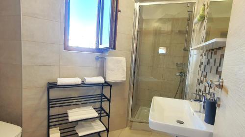 a bathroom with a sink and a shower at Apartments Villa Tre Marie in Rovinj