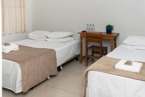 Postel nebo postele na pokoji v ubytování Castelo Palace Hotel