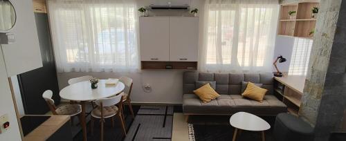 a small living room with a couch and a table at Студио Нико - Царево in Tsarevo