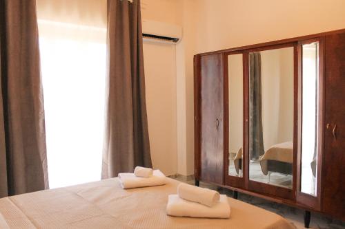 Postel nebo postele na pokoji v ubytování La Casetta di Matteo - Sciuti Apartment