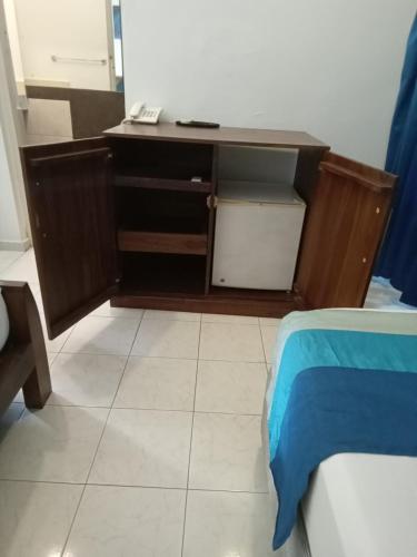 a wooden desk in a room with a bed at Mount Marina Villas 12 in Galle