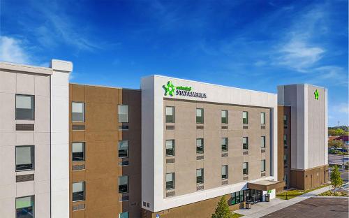 a building with a starbucks sign on top of it at Extended Stay America Premier Suites - Belgrade - Bozeman - Yellowstone Airport in Belgrade