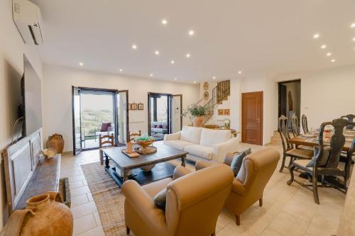 a living room with a couch and a table at Villa Destino Italy, Umbria Tuscany boarder in Montone